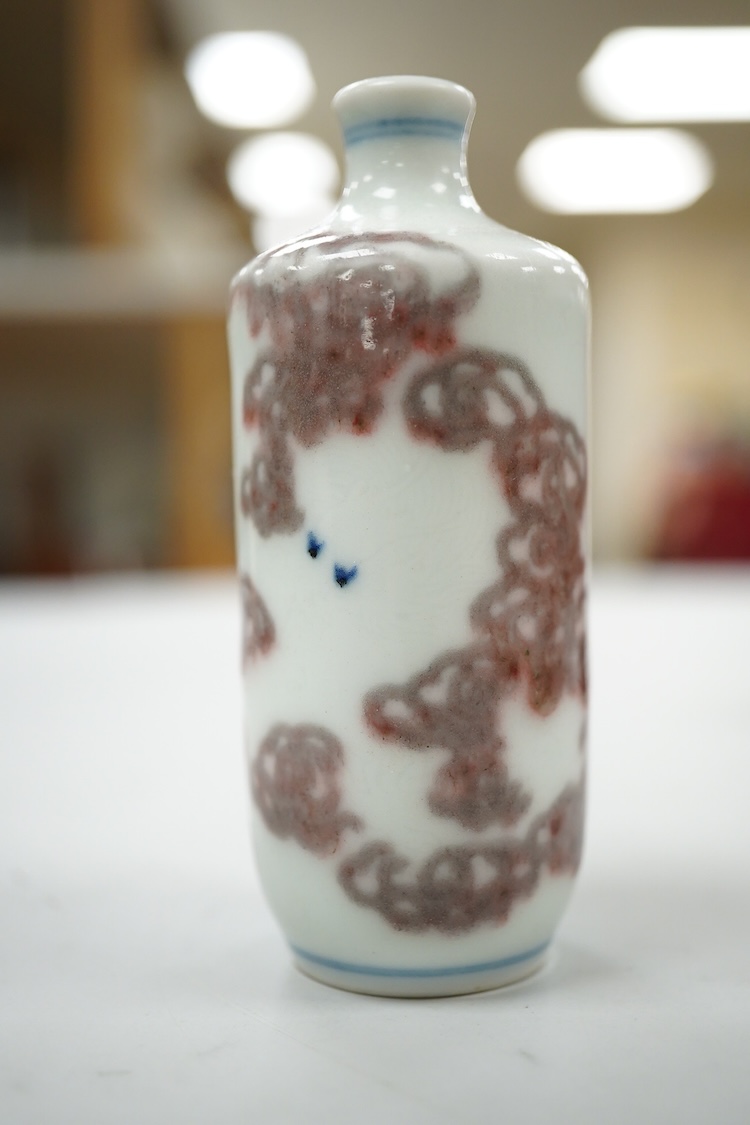 A Chinese cinnabar lacquer snuff bottle, a glass overlay snuff bottle and an underglaze copper red snuff bottle-9cm high (3)